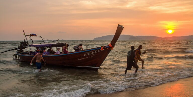 A longtail coming ashore at sunset