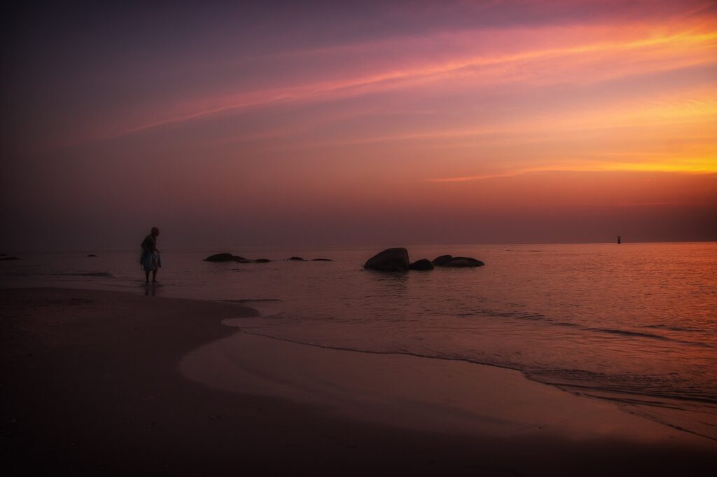 A fisherman on Hua Hin Beach at dawn